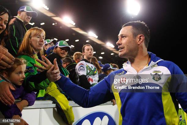 Brett White of the Raiders farewells fans on his lap of honour during the round 26 NRL match between the Canberra Raiders and the Parramatta Eels at...