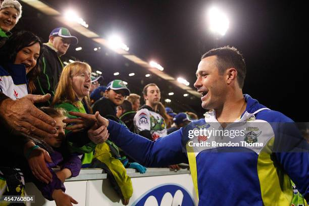 Brett White of the Raiders farewells fans on his lap of honour during the round 26 NRL match between the Canberra Raiders and the Parramatta Eels at...