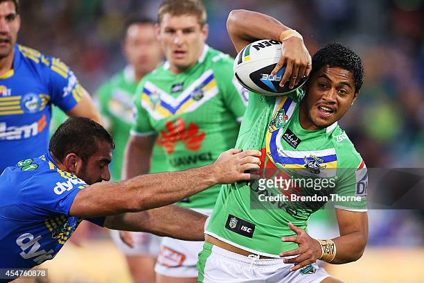 Anthony Milford of the Raiders runs the ball during the round 26 NRL match between the Canberra Raiders and the Parramatta Eels at GIO Stadium on...