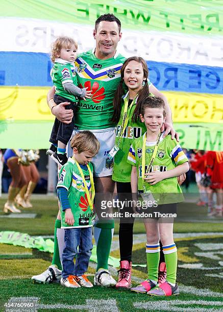 Brett White of the Raiders poses with his children prior to the round 26 NRL match between the Canberra Raiders and the Parramatta Eels at GIO...