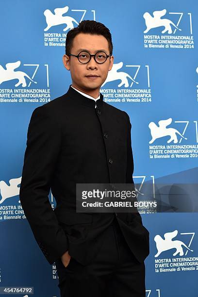 Actor Zhang Yi poses during the photocall of the movie "Huangjin Shidai" presented out of competition at the 71st Venice Film Festival on September...