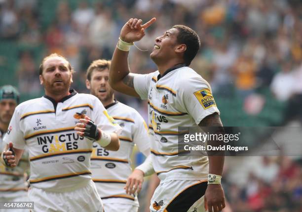 Nathan Hughes of Wasps celebrates after scoring a try during the Aviva Premiership match between Saracens and Wasps at Twickenham Stadium on...