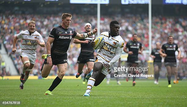 Christian Wade of Wasps races clear to score his second try during the Aviva Premiership match between Saracens and Wasps at Twickenham Stadium on...