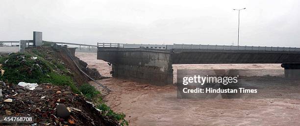 Portion of the Bhagwati nagar Bridge over river tawi collapsed during heavy rain and flash floods, on September 6, 2014 in Jammu, India. The region...