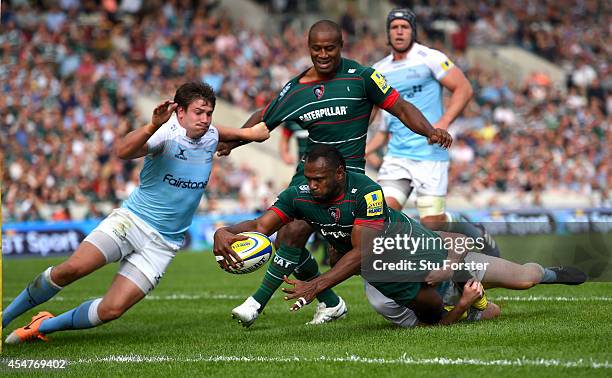 Adam Powell of the Falcons fails to stop Tigers winger Vereniki Goneva from scoring his second try during the Aviva Premiership match between...