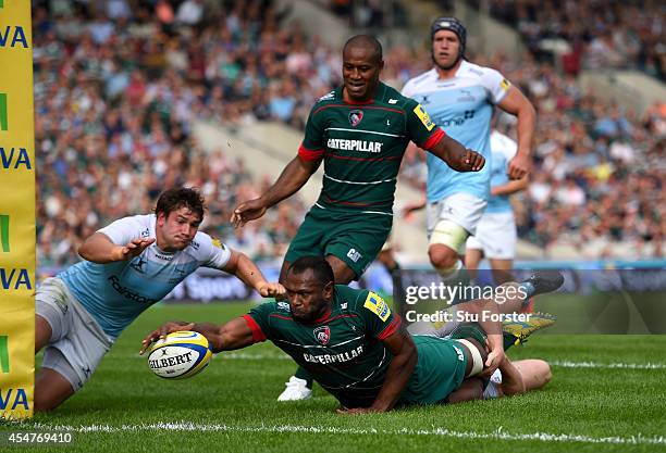 Adam Powell of the Falcons fails to stop Tigers winger Vereniki Goneva from scoring his second try during the Aviva Premiership match between...