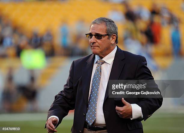 General Manager Dave Gettleman of the Carolina Panthers looks on from the field before a preseason game against the Pittsburgh Steelers at Heinz...