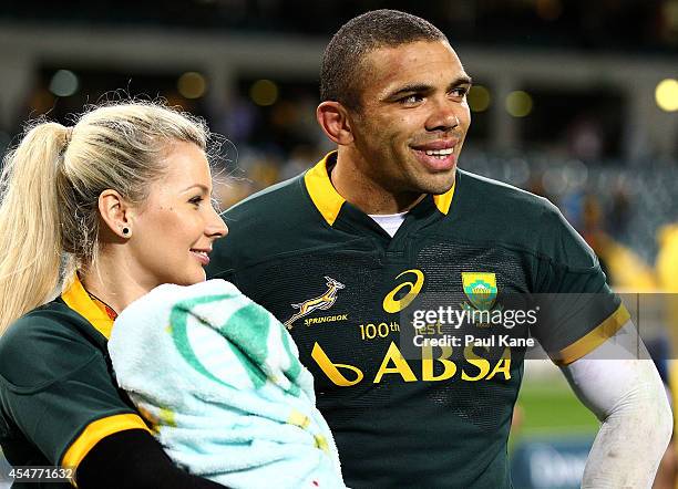 Bryan Habana of the Springboks looks on with his wife Janine and son Timothy after playing his 100th Test during The Rugby Championship match between...