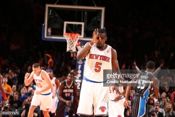 Tim Hardaway Jr. #5 of the New York Knicks reacts after hitting a three-point shot during a game against the Orlando Magic at Madison Square Garden...