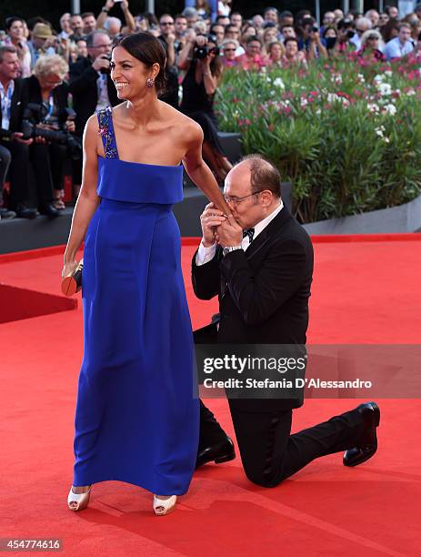 Venezia 71 Jury member Carlo Verdone kisses the hand of Venezia 71 Jury member Jhumpa Lahiri attends the Closing Ceremony of the 71st Venice Film...