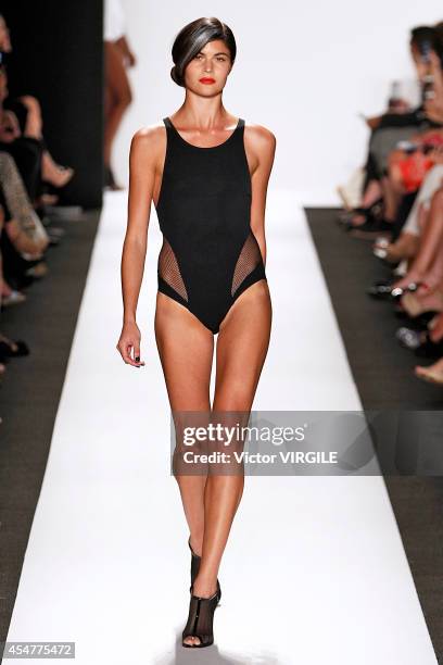 Model walks the runway at the Carmen Marc Valvo 25th Anniversary fashion show during Mercedes-Benz Fashion Week Spring 2015 at The Theatre at Lincoln...