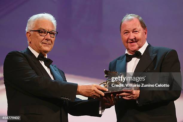 Director Roy Andersson receives the Golden Lion Award for Best Film for 'A Pigeon Sat On A Branch Reflecting On Existence' from President of the...