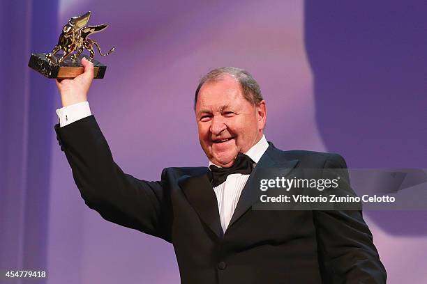 Director Roy Andersson poses with the Golden Lion Award for Best Film for 'A Pigeon Sat On A Branch Reflecting On Existence' on stage during the...