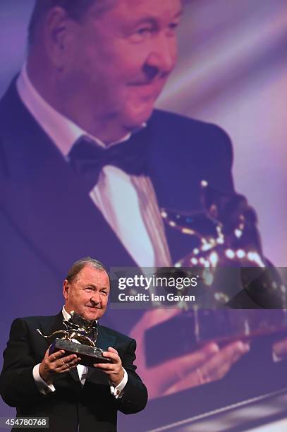 Director Roy Andersson poses with the Golden Lion Award for Best Film for 'A Pigeon Sat On A Branch Reflecting On Existence' on stage during the...