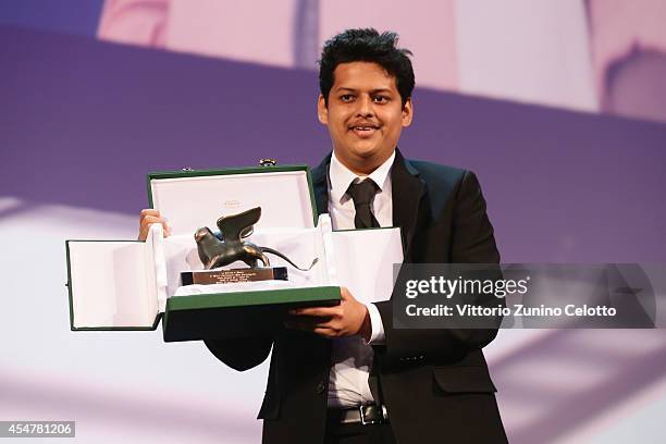 Director Chaitanya Tamhane poses onstage with the Lion of the Future - 'Luidi de Laurentis' Venice award for a Debut Film for his movie 'Court' on...