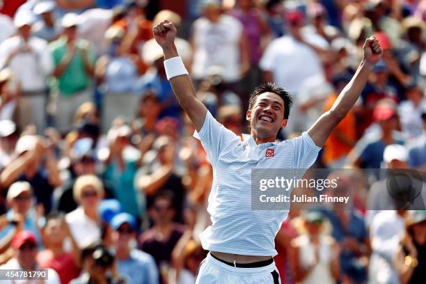 Kei Nishikori of Japan celebrates after defeating Novak Djokovic of Serbia in their men's singles semifinal match on Day Thirteen of the 2014 US Open...