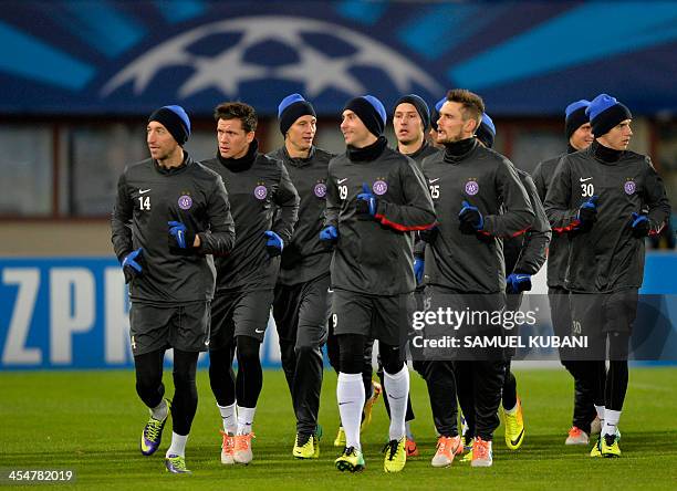 Austria Wien football team's players run during a training session at Erns Happel stadium in Vienna on December 10 on the eve of the UEFA Champions...