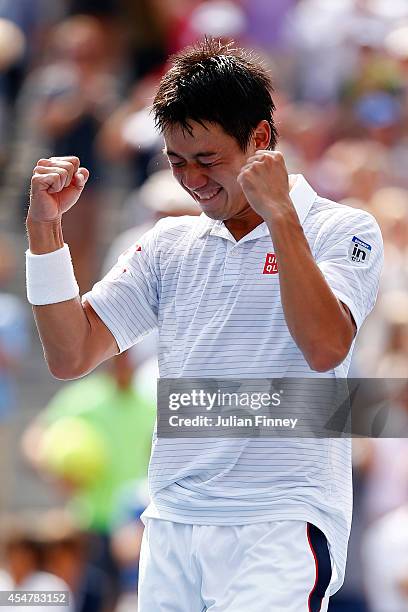 Kei Nishikori of Japan celebrates after defeating Novak Djokovic of Serbia in their men's singles semifinal match on Day Thirteen of the 2014 US Open...