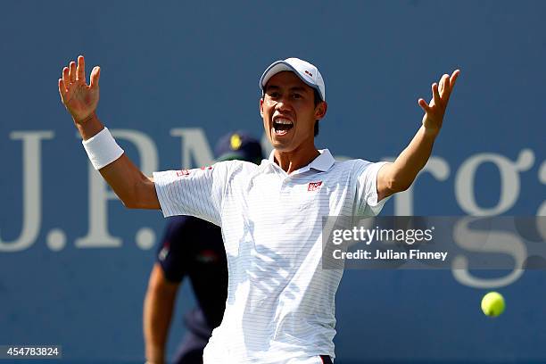 Kei Nishikori of Japan celebrates after defeating Novak Djokovic of Serbia in their men's singles semifinal match on Day Thirteen of the 2014 US Open...