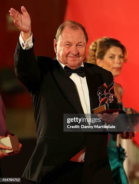 Director Roy Andersson poses with the Golden Lion Award for Best Film for 'A Pigeon Sat On A Branch Reflecting On Existence' during the award winners...