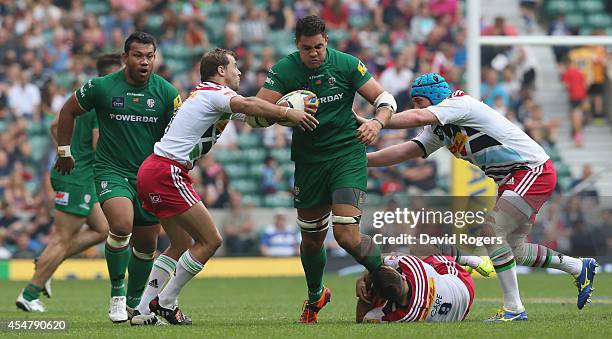 Dan Leo of London Irish is tackled by Nick Evans ; Danny Care and Joe Gray during the Aviva Premiership match between London Irish and Harlequins at...