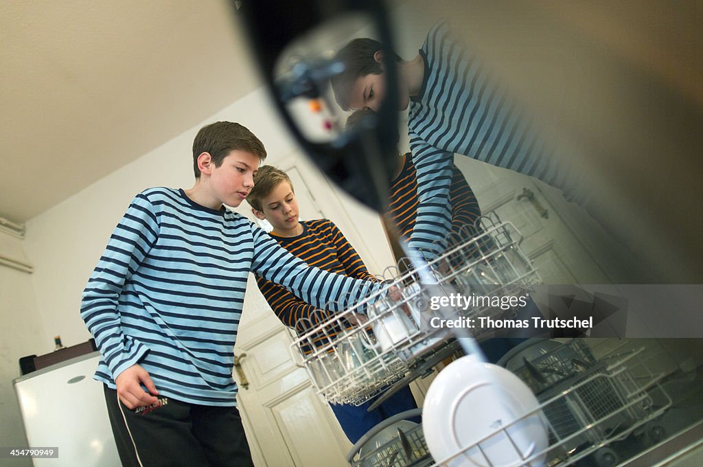 Children Loading The Dishwasher