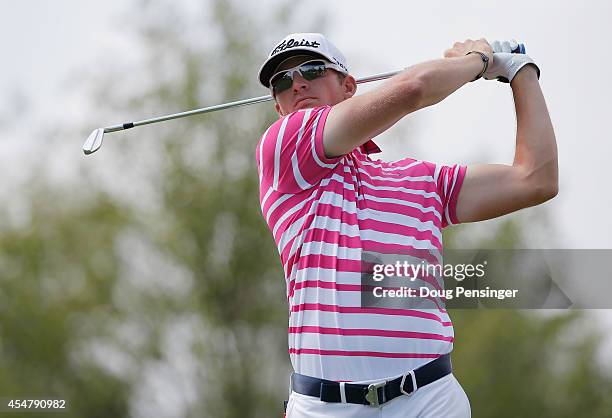 Morgan Hoffmann of the United States watches his tee shot on the eighth hole during the third round of the BMW Championship at the Cherry Hills...