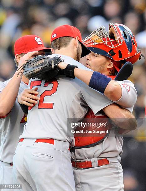 Michael Wacha of the St. Louis Cardinals celebrates with Yadier Molina after a 2-1 win during Game Four of the National League Division Series...