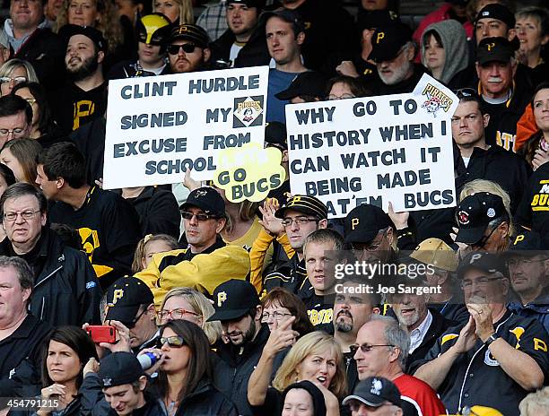 Pittsburgh Pirates fans show support during Game Four of the National League Division Series against the St. Louis Cardinals on Monday, October 7,...