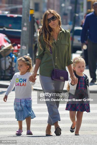 Sarah Jessica Parker holds hands with her twin daughters, Marion "Loretta" and Tabitha, while shopping in downtown Mahattan. On September 15, 2013 in...