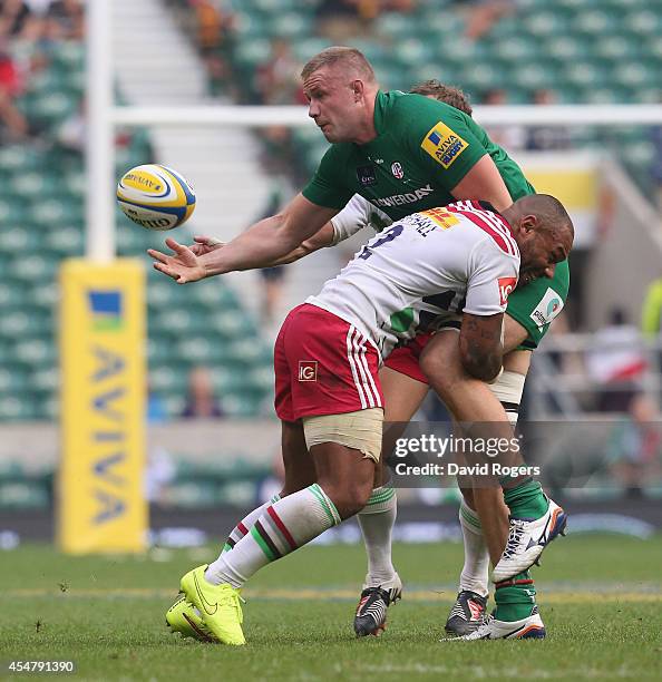 Kieran Low of London Irish is tackled by Jordan Turner-Hall during the Aviva Premiership match between London Irish and Harlequins at Twickenham...