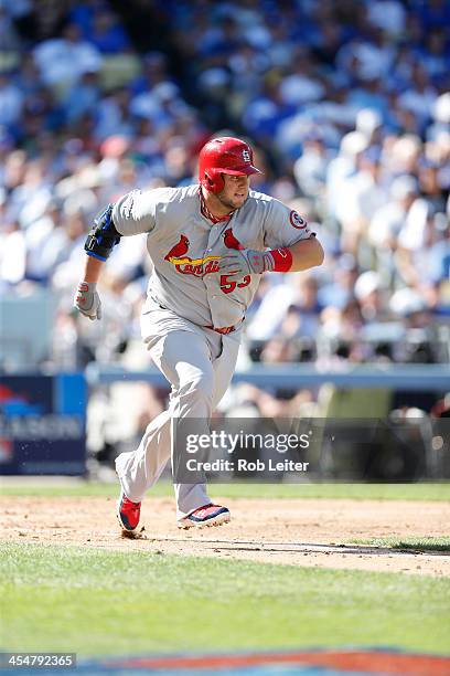 Matt Adams of the St. Louis Cardinals runs to first base during Game Five of the National League Championship Series against the Los Angeles Dodgers...