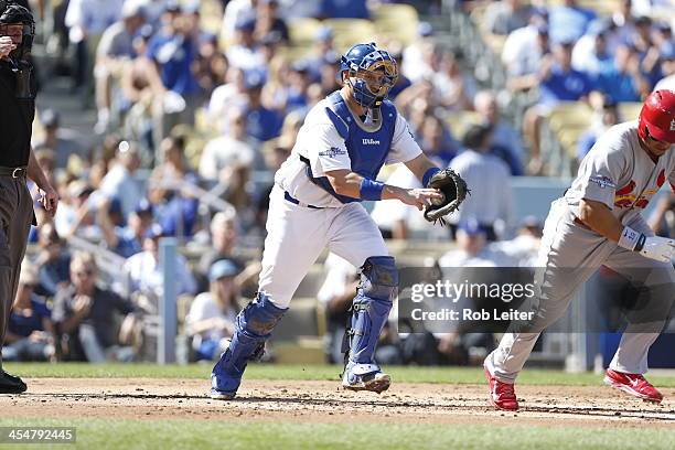 Ellis of the Los Angeles Dodgers makes the throw to first during Game Five of the National League Championship Series against the St. Louis Cardinals...