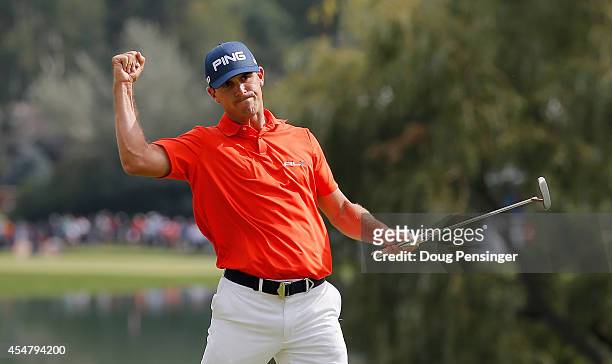 Billy Horschel of the United States celebrates his birdie putt on the 18th green en route to his seven-under par 63 during the third round of the BMW...