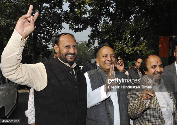 Newly elected BJP MLAs Pawan Sharma, Mahinder Nagpal and Ramkrishan Singhal at the meeting of newly elected BJP MLAs at Delhi BJP office on December...