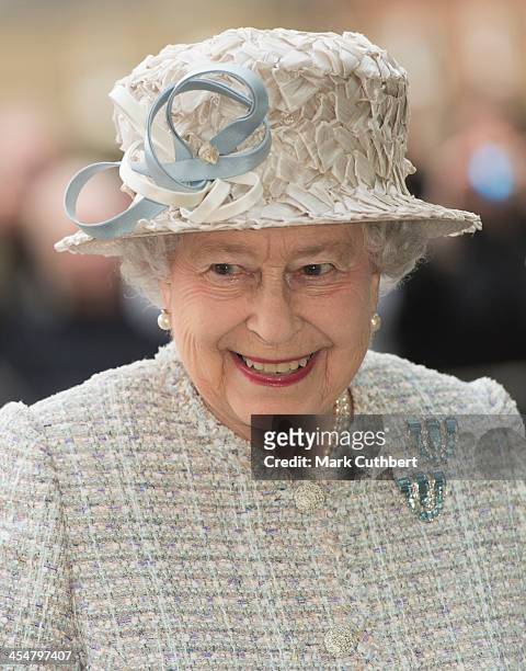 Queen Elizabeth II visits the new Barnardo's HQ in Barkingside on December 10, 2013 in London, England.