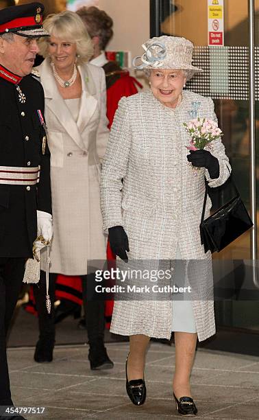 Camilla, Duchess of Cornwall and Queen Elizabeth II visit the new Barnardo's HQ in Barkingside on December 10, 2013 in London, England.