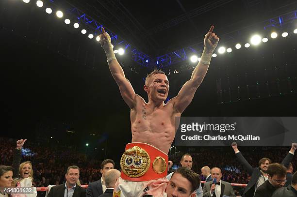 The new IBF super-bantamweight world champion Carl Frampton of Northern Ireland celebrates after his victory over Kiko Martinez of Spain, at the...