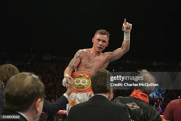 The new IBF super-bantamweight world champion Carl Frampton of Northern Ireland celebrates after his victory over Kiko Martinez of Spain, at the...