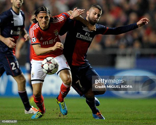 Benfica's Serbian midfielder Ljubomir Fejsa vies with PSG's midfielder Jeremy Menez during the UEFA Champions League Group C football match SL...