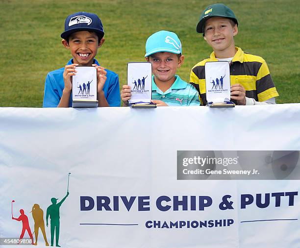 Winners in the boys 7-9 putt category second place Sergio Sanchez, first place Tyler Spielman and third place Logan Medcalf at the Drive Chip and...