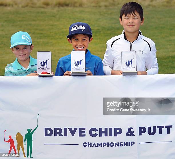 Winners in the boys 7-9 chip category second place Tyler Spielman, first place Sergio Sanchez and third place Ethan Posthumus at the Drive Chip and...
