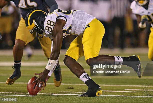 Devin Gardner of the Michigan Wolverines tries to recover his own fumble against the Notre Dame Fighting Irish at Notre Dame Stadium on September 6,...