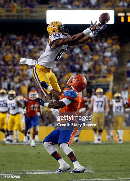 Travin Dural of the LSU Tigers reaches for a pass in front of