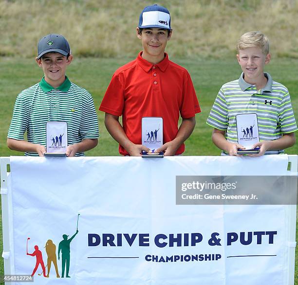 Winners in the boys 12-13 drive category Ethan Adam, first place Scotty Kennon and third place Johnny Ward at the Drive Chip and Putt Championship at...