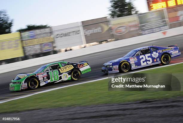 Alex Tagliani, driver of the EpiPen/Dicom Express Dodge leads Joey McColm, driver of the PartSource/Toronto Maple Leafs Dodge during the Hudco...