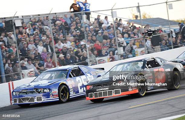 Joey McColm, driver of the PartSource/Toronto Maple Leafs Dodge and Matthew Scannell, driver of the OMVIC Dodge race side by side during the Hudco...