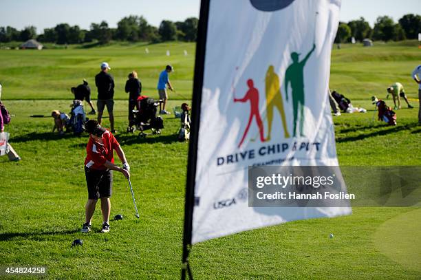 Regional Finals Boys 12-13 competitor chips at the Drive, Chip and Putt competition on September 6, 2014 in Blaine, Minnesota.