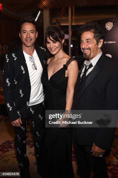 Actor Robert Downey Jr., Lucila Sola and actor Al Pacino attend the Warner Bros. Pictures and Dolce & Gabbana TIFF cocktail party during the 2014...