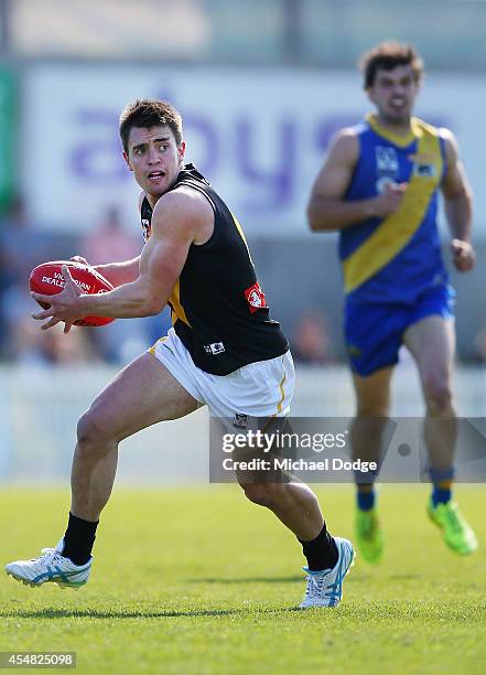 Ben Speight of Werribee runs with the ball during the VFL Semi Final match between Williamstown and Werribee at North Port Oval on September 7, 2014...
